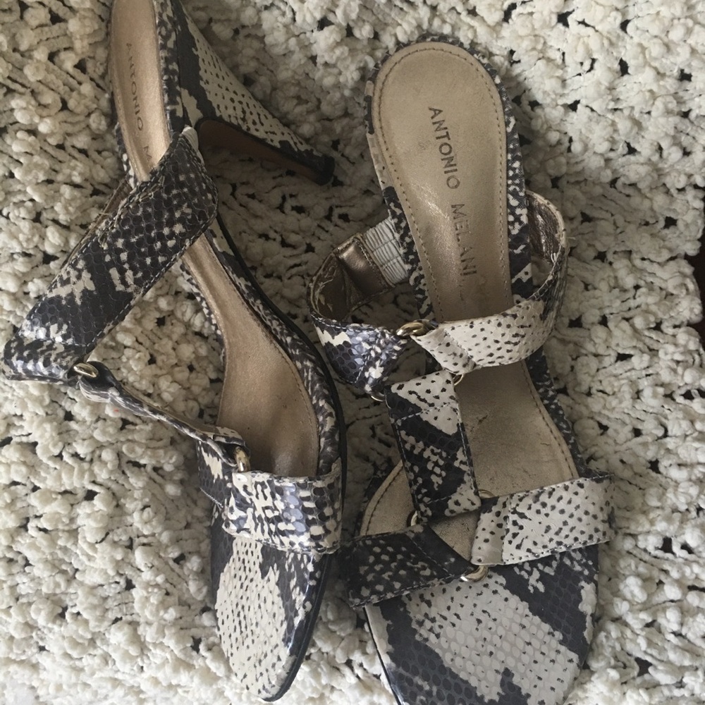 Snake skin high heeled designer shoes